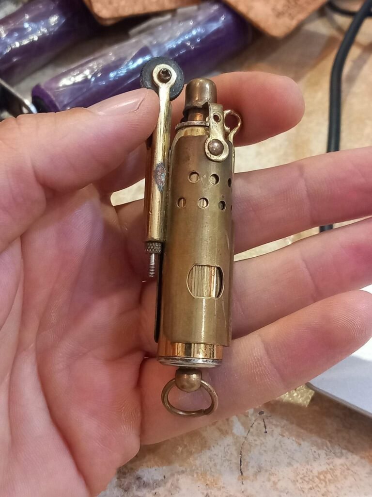The WWI Brass Trench Lighter marked JMCO is a fascinating piece of military history.